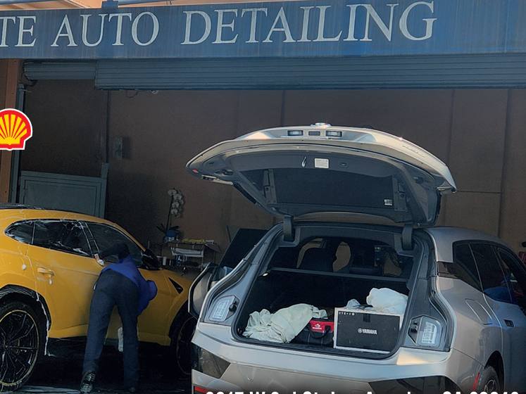 Crew hand-washing a car at Majestic